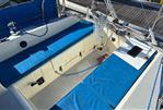 Westerly Merlin - 1986 Westerly Merlin sailboat cockpit with blue cushions and nautical equipment.