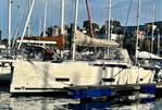 Dufour 390 - 2021 Dufour 390 sailboat docked in a marina, surrounded by other boats.