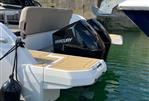 Greenline Neo - 2018 Greenline Neo boat with Mercury outboard engines docked in a marina.