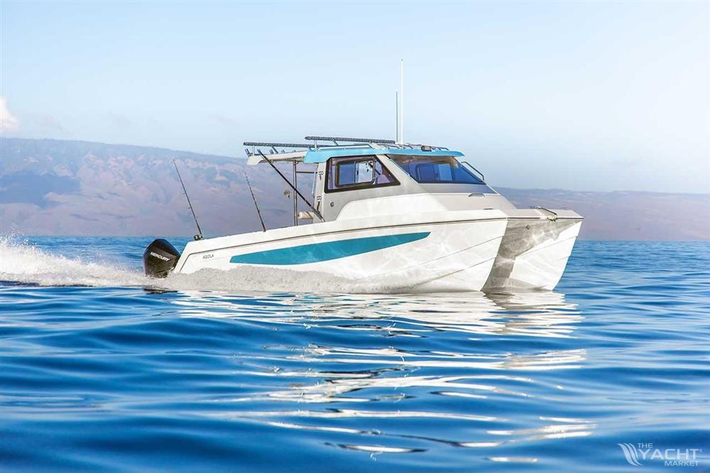 Aquila 28 Molokai Cuddy - 2026 Aqulia 28 Molokai Cuddy cruising on calm blue waters.