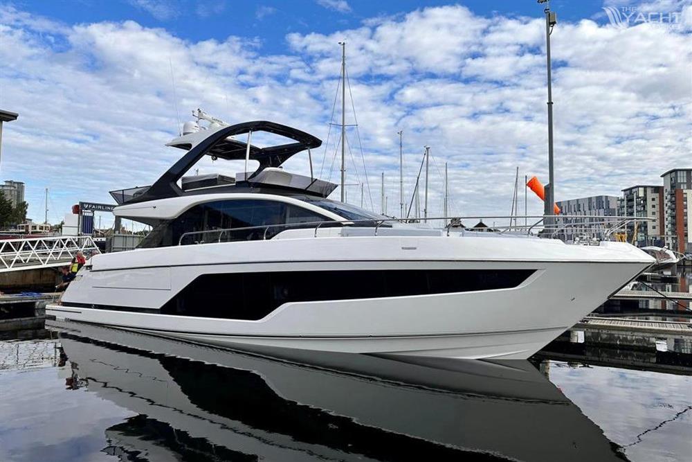 Fairline Squadron 58 - 2024 Fairline Squadron 58 yacht docked in a marina under a partly cloudy sky.