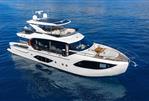 Absolute 70 Fly - Luxury Absolute 70 Fly yacht cruising on calm blue waters, 2026 model.