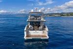 Absolute 70 Fly - Luxury Absolute 70 Fly yacht cruising on open sea, 2026 model, scenic coastal backdrop.