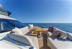 Absolute 70 Fly - Luxurious 2026 Absolute 70 Fly yacht deck with elegant seating and ocean view.