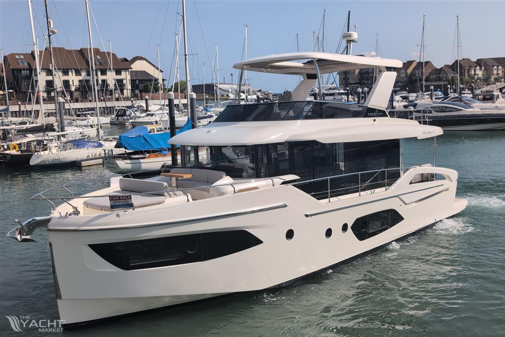 Absolute Navetta 53 - 2025 Absolute Navetta 53 yacht docked in a marina, showcasing sleek design and luxury features.