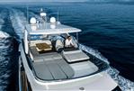 Absolute 52 FLY - 2025 Absolute 52 FLY yacht cruising on open water, featuring spacious flybridge.