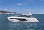 Fairline Targa 40 - 2025 Fairline Targa 40 yacht cruising on a sunny day, coastal background.