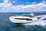 Fairline Targa 40 - 2025 Fairline Targa 40 yacht cruising on open sea under blue sky.