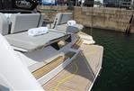 Fairline Targa 40 - 2025 Fairline Targa 40 yacht with teak deck and sun loungers at dock.