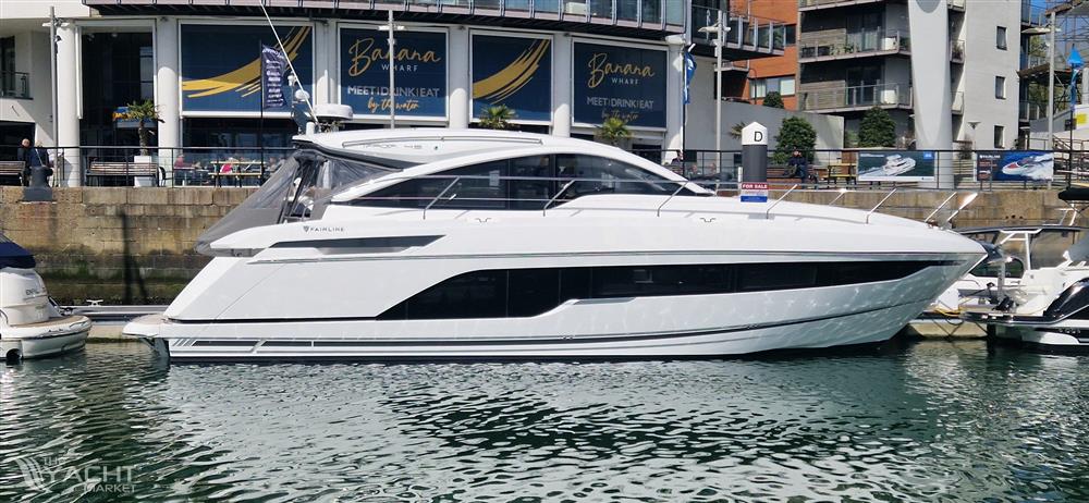 Fairline Targa 45 GT - 2022 Fairline Targa 45 GT yacht docked in a marina, side view.