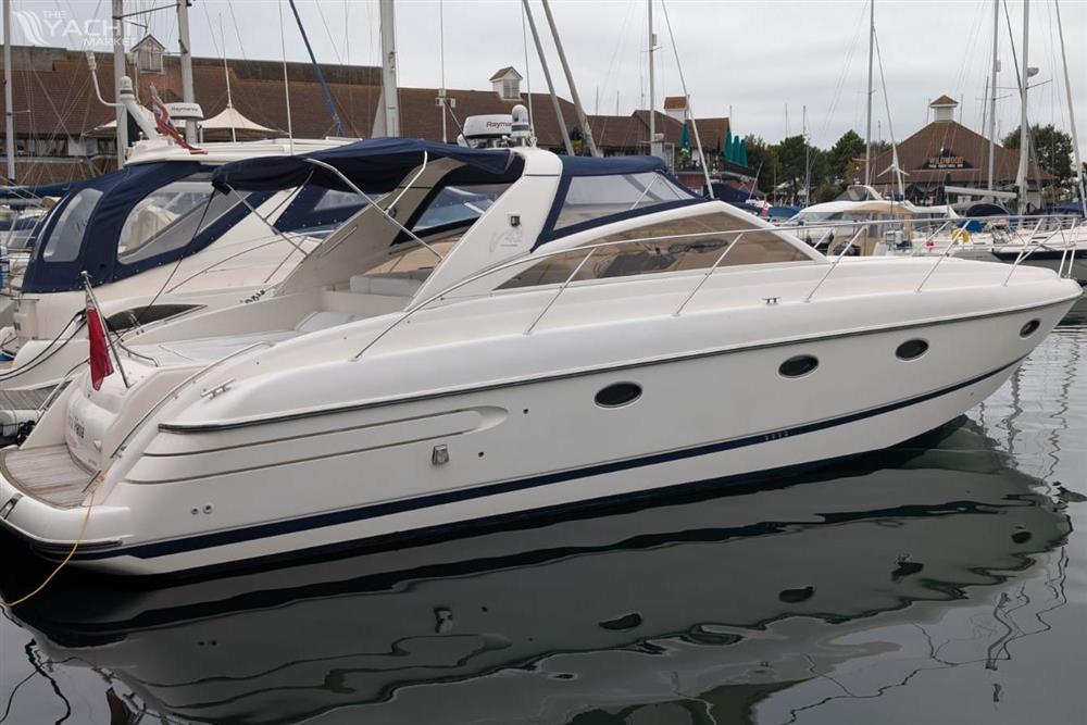 Princess V42 - 2001 Princess V42 yacht docked in marina, sleek design, white exterior.