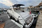 Princess V42 - 2001 Princess V42 yacht docked at marina, featuring sleek design and spacious deck.