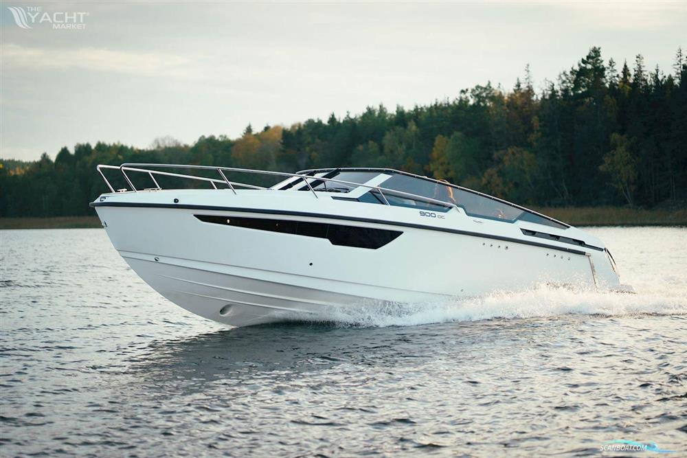 Flipper 900 DC - 2026 Flipper 900 DC boat cruising on a serene lake with forested background.