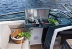 Flipper 800 DC - Flipper 800 DC 2026 boat with outdoor kitchen, fresh produce, and scenic water view.