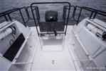 Falcon C7 - 2026 Falcon C7 boat deck with railing and motor, on calm water.