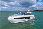 Fairline Targa 40 - 2026 Fairline Targa 40 yacht cruising on open water under a partly cloudy sky.