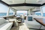 Fairline Phantom 65 - Luxurious interior of 2026 Fairline Phantom 65 yacht with elegant seating and ocean view.