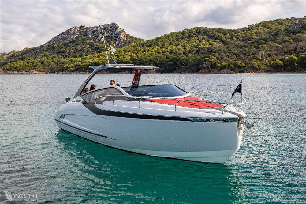 Fairline F//Line 33 Outboard - 2026 Fairline F//Line 33 Outboard yacht on scenic water with lush hills in background.