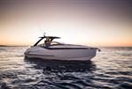 Fairline F//Line 33 Outboard - 2026 Fairline F//Line 33 Outboard yacht on serene water at sunset.