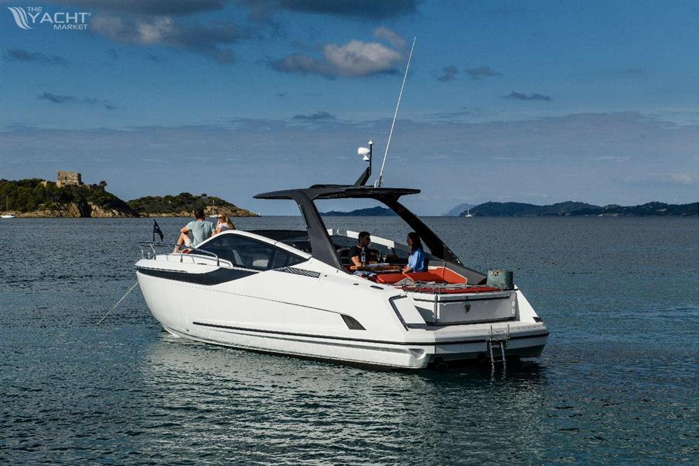 Fairline F//Line 33 - 2026 Fairline F//Line 33 yacht on serene water with passengers enjoying the view.
