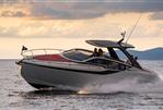 Fairline F//Line 33 - 2026 Fairline F//Line 33 yacht cruising on open water at sunset.