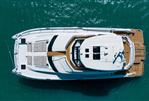 Aquila 70 Luxury - Aerial view of 2026 Aquila 70 Luxury yacht on turquoise water.