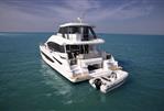 Aquila 54 Yacht - Aquila 54 Yacht 2026 cruising on clear blue ocean waters.
