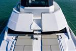 Aquila 54 Yacht - 2026 Aquila 54 Yacht with spacious deck and sun loungers on calm water.