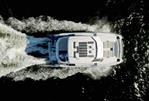 Aquila 50 Power Catamaran - Aquila 50 Power Catamaran 2026 cruising on open water, aerial view.