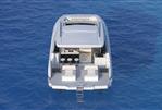 Aquila 46 COUPE - Aquila 46 Coupe 2026 yacht on open sea, rear view showcasing deck and seating.