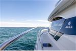 Aquila 44 Yacht - 2026 Aquila 44 Yacht cruising on open sea under clear blue sky.