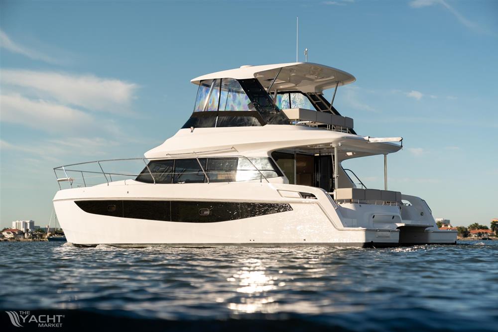 Aquila 42 Yacht - 2026 Aquila 42 Yacht cruising on calm waters under a clear blue sky.