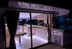 Aquila 42 Coupe - Luxurious interior of 2026 Aquila 42 Coupe yacht with modern kitchen and ambient lighting.