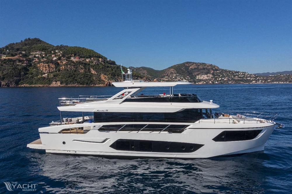 Absolute NAVETTA 75 - 2026 Absolute NAVETTA 75 yacht cruising on blue ocean near scenic coastline.