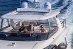 Absolute Navetta 68 - Luxury Absolute Navetta 68 yacht cruising with passengers, 2026 model, on open water.