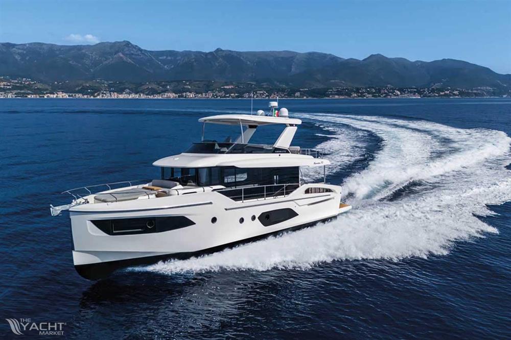 Absolute Navetta 53 - Luxury Absolute Navetta 53 yacht cruising on open sea, 2026 model, with scenic mountain backdrop.