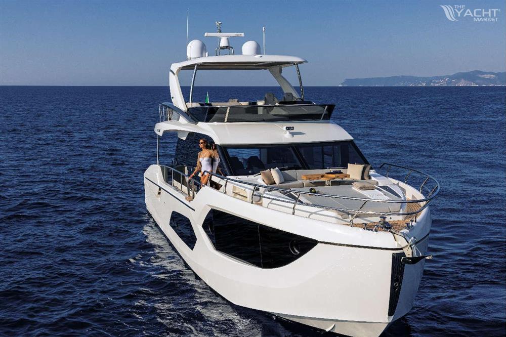 Absolute 60 Fly - 2026 Absolute 60 Fly yacht cruising on open sea with clear blue skies.