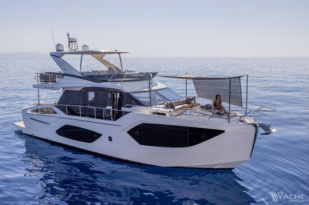 Absolute 56 FLY - Luxury Absolute 56 FLY yacht cruising on calm blue waters, 2026 model.