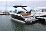 Cobalt R6 - 2021 Cobalt R6 boat docked in marina, featuring sleek design and spacious seating.