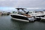 Cobalt R6 - 2021 Cobalt R6 boat docked in a marina, surrounded by other vessels.