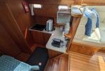 Linssen Grand Sturdy 380 AC - Interior of 2008 Linssen Grand Sturdy 380 AC yacht with kitchenette and seating area.
