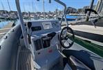 Highfield DL 540 - 2019 Highfield DL 540 boat interior at marina, featuring steering console and controls.