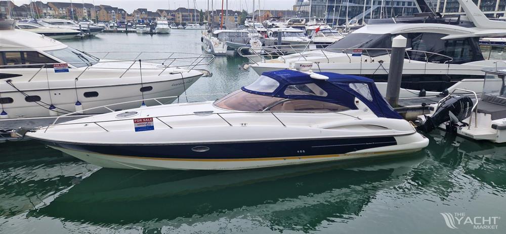Sunseeker Superhawk 34 - 2003 Sunseeker Superhawk 34 yacht docked in a marina, surrounded by other boats.