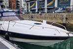 Sunseeker Superhawk 34 - 2003 Sunseeker Superhawk 34 docked in marina, sleek design, luxury motor yacht.