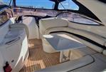 Sunseeker Superhawk 34 - Luxurious interior of 2003 Sunseeker Superhawk 34 yacht with elegant seating and table.