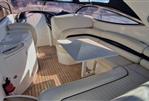 Sunseeker Superhawk 34 - Luxurious interior of 2003 Sunseeker Superhawk 34 yacht with elegant seating and table.