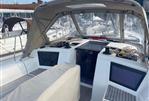 Dufour 390 - Cockpit of 2021 Dufour 390 sailboat with covered seating and navigation equipment.