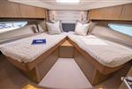 Princess V58 Open - Luxurious cabin interior of 2016 Princess V58 Open yacht with twin beds.