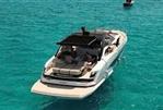 Sunseeker Superhawk 55 - 2024 Sunseeker Superhawk 55 yacht cruising on clear turquoise waters.