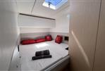 Chaser 54 Laguna - Luxurious cabin interior of 2023 Chaser 54 Laguna yacht with red pillows and skylight.